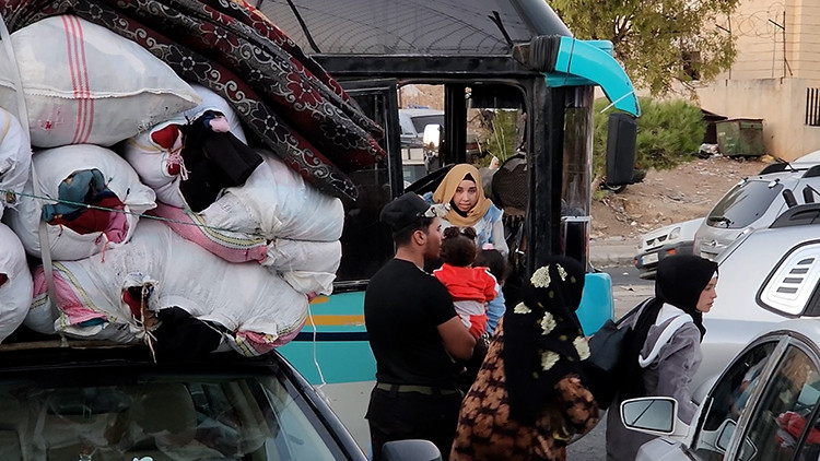 Binlerce Lübnanlı Suriye'de Esed rejiminin boşalttığı şehirlere geliyor - Resim : 1